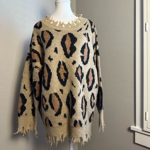 Distressed look tiger print long sleeve sweater